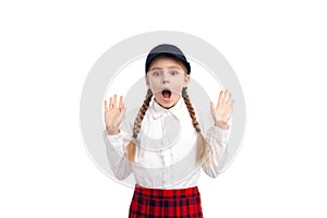 Shocked schoolgirl looking at camera