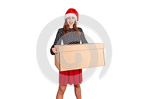 Shocked and surprised pretty young woman holding big carton gift box. isolated on white background. holidays concept