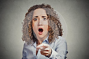 Shocked terrified business woman pointing finger