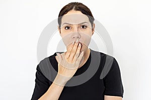 Shocked woman covering her mouth with hand