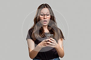 Shocked woman portrait overwhelming news phone