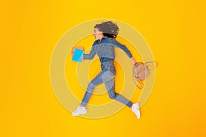 Shocked Woman Student Running Holding Copybooks And Backpack, Yellow Background