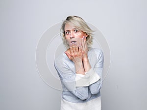 Shocked woman in studio.