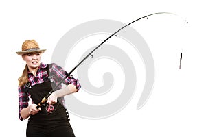 Shocked woman in sun hat holding fishing rod