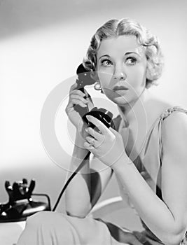 Shocked woman on telephone