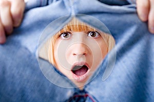 Shocked Woman with Torn Jeans