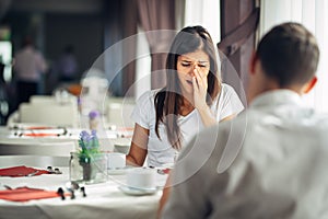 Shocked woman in disbelief handling bad news.Relationship discussion,marriage problems.Woman hearing confession photo
