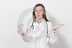 Shocked young doctor woman with stethoscope, glasses isolated on white background. Female doctor in medical gown holding