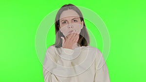 Shocked Young Woman Feeling Surprised on Green Background