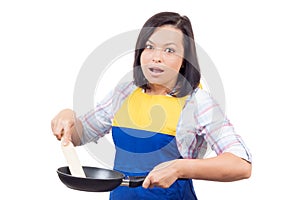 Shocked Young Woman with Frying Pan