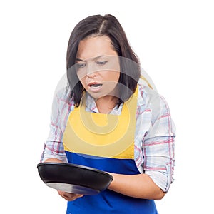 Shocked Young Woman with Frying Pan