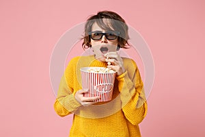 Shocked young woman girl in 3d imax glasses posing isolated on pink background. People sincere emotions in cinema