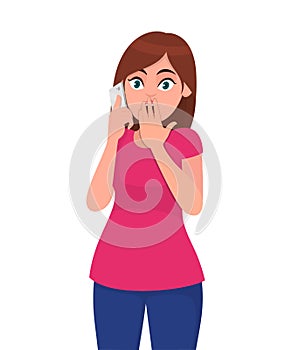 Shocked young woman speaking on the smartphone, covers her mouth with hand, shocked with shame for mistake, expression of fear.