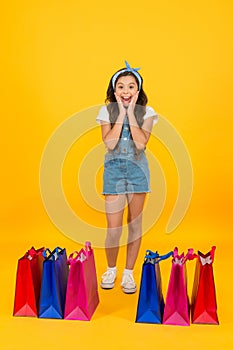 Shocking discount. Shopping day. Fashion boutique. Girl shopping. Fashion shop. Little girl with shopping packages