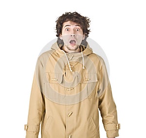 Shocking man in raincoat on white