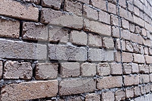 Shoddy brick work on a wall using clay bricks in Asia