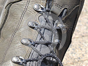 Shoe laces on mountain shoe closeup.