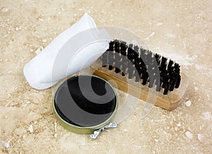 Shoe Polish Kit Black Tile Background photo