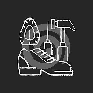 Shoe repair and reconditioning chalk white icon on black background photo