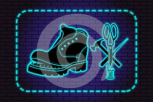 Shoe repair service. Neon symbol in old retro style. On background of brick illuminated wall