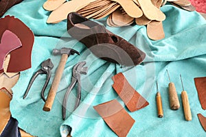 Shoe with set tools on leather in workshop