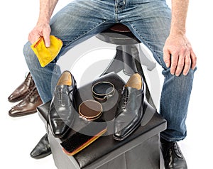 Shoe shiner in front of his equipment