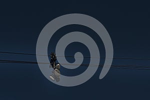 Shoe tossing - two pairs of sneakers hanging on a telephone wire