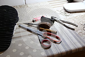 Shoemaker crafting tools set on a table