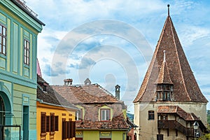 Shoemakers guild tower and colorful romanian houses, Sighisoara, Transylvania photo
