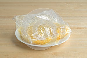 Shoepeg white corn with a butter sauce in a bag