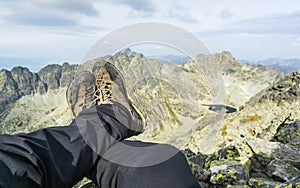 Shoes approach on the background of mountains.