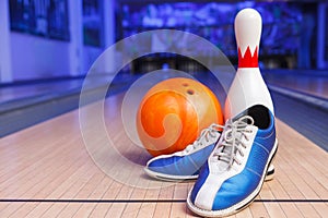 Shoes, bowling pin and ball