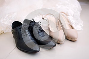 Shoes of bride and groom preparation for wedding concept