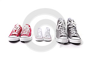 Shoes in father big, mother medium and son or daughter small kid size in family love concept