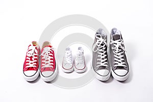 Shoes in father big, mother medium and son or daughter small kid size in family love concept
