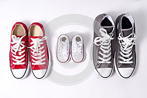 Shoes in father big, mother medium and son or daughter small kid size in family love concept photo