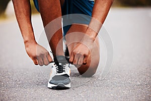 Shoes, hands and runner tie lace with fitness outdoor, road and marathon with start. Exercise, healthy and ready for