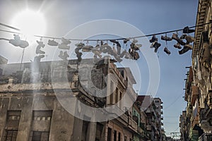 Shoes hanging on a street in La Habana photo