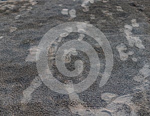 Shoes marks on the river sand