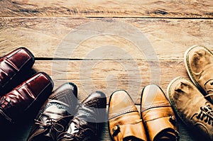 Shoes for men various styles on a wooden floor - lifestyles.