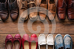 shoes with men and women various styles on a wooden floor - life