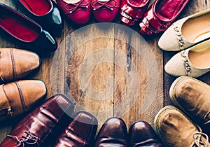 Shoes with men and women various styles on a wooden floor