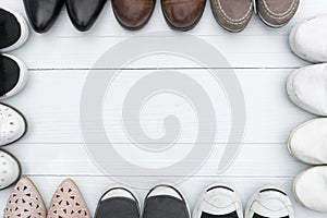 Shoes are placed on a wooden floor.