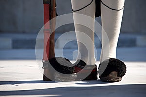 Shoes and rifle of Greek presidential guardsman