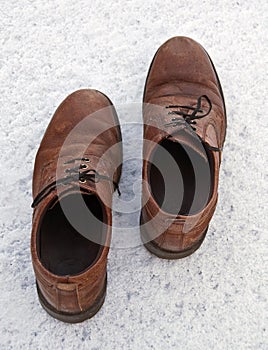 A pair of Men's Shoes on the snow.