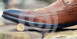 Shoes stopped the coin as a symbol of thrift and savings photo