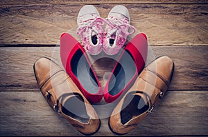 Shoes, three pairs of dad, mom, daughter - the family concept.