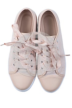 shoes on a white background, women`s pink canvas sneakers