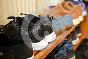 Shoes on wooden shoe rack