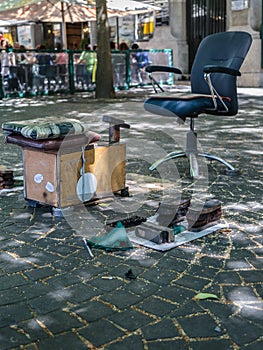 Shoeshiner Equipments in the Street: Chair, Wooden Footrest, Brushes and Rag